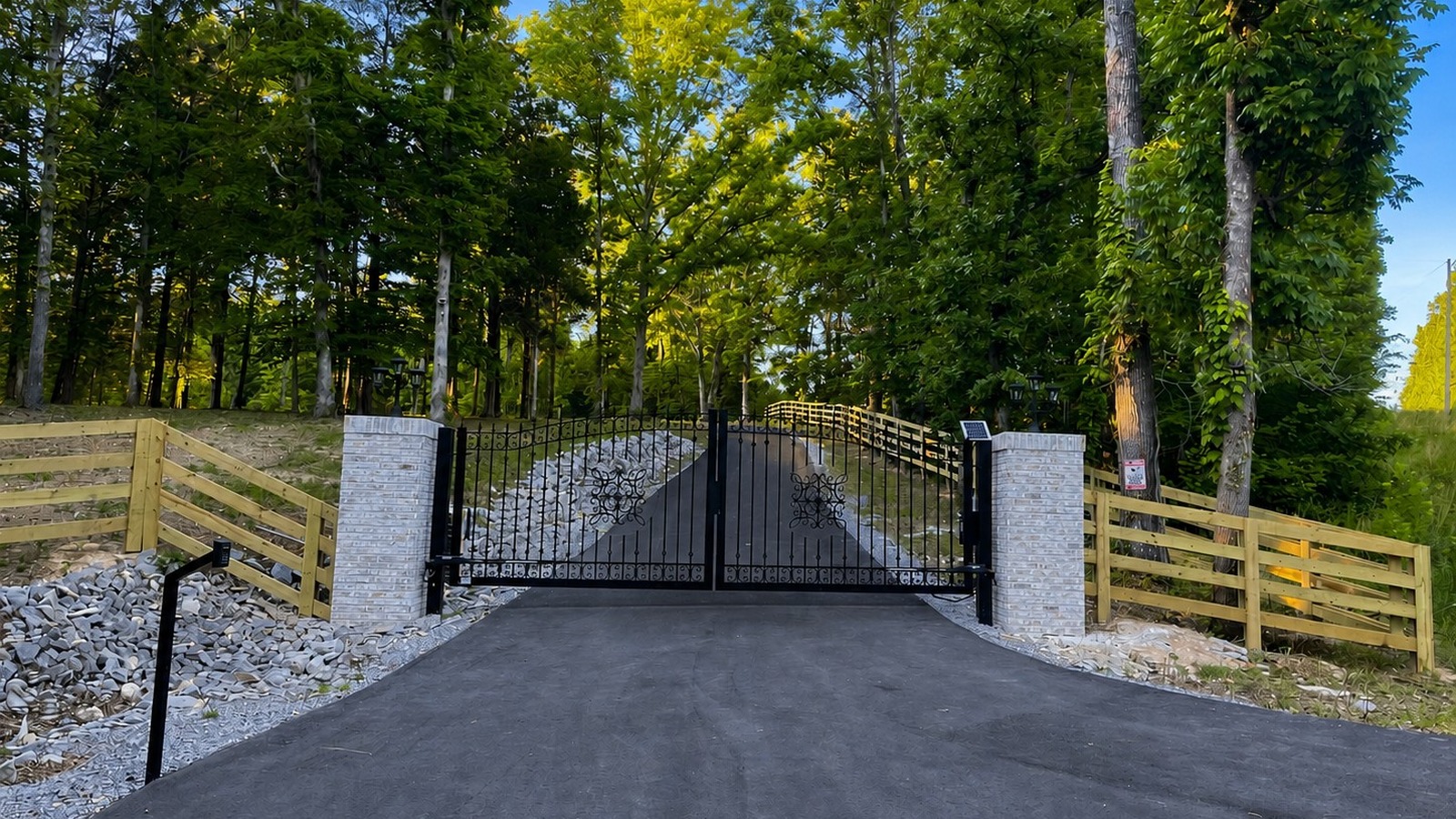 Aerial view of the estate within wooded acreage